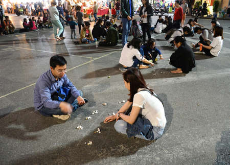 Hanoi, Vietnam - Feb 19, 2107 :  folk games are played on the street by vietnamese at walking street around HoanKiem Lake in Hanoi Old Quarter( Pho co Hanoi)のeditorial素材