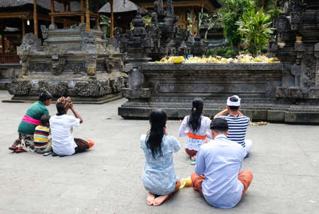 Bali, Indonesia - September  9,2017:  Unidentified  balinese prays at Pura Tirta Empul Hindu templeのeditorial素材