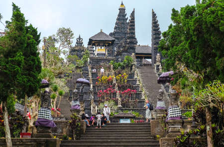 Besakih, Indonesia - September 9, 2017: Visitors explore the immense Pura Besakih Temple (Royal Temple of Besakih). the most important temple and holiest Hindu temple in Bali.のeditorial素材