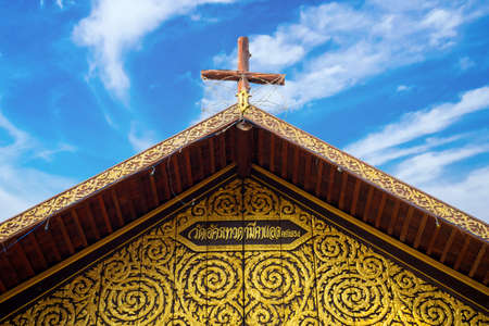 Ban Song Yae church, The Largest wooden church in Thailand at Yasothon province, "Unseen Thailand, The Largest wooden church Thailand " on Entrance billboardの写真素材