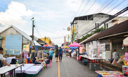 Nakhon Phanom, Thailand - Aug 11, 2018:  Nakhon Phanom Walking  Street market in front of Clock Tower, historical landmark of Nakhon Phanom Province built by Vietnamese people in 1960, on Thailand.のeditorial素材