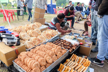 Srinagar, India - April 22, 2017 : A man selling Saffron tea and Kashmir bakery in Tulip Gardenのeditorial素材