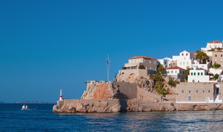 The historic entrance to the port of Hydra island, Greeceの写真素材