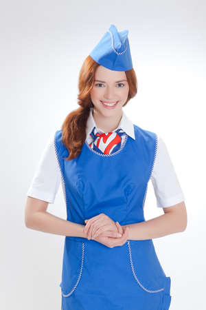 Attractive young stewardess isolated over white backgroundの写真素材