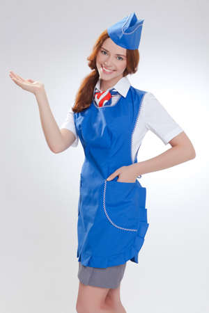 Attractive young stewardess isolated over white backgroundの写真素材