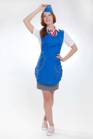 Attractive young stewardess isolated over white backgroundの写真素材