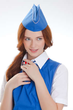 Attractive young stewardess isolated over white backgroundの写真素材