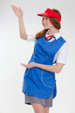 Attractive young stewardess isolated over white backgroundの写真素材