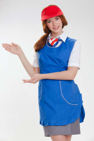 Attractive young stewardess isolated over white backgroundの写真素材