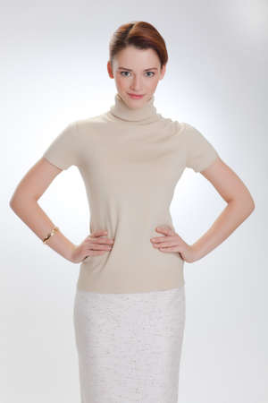 Portrait of a beautiful woman in a beige sweaterの写真素材