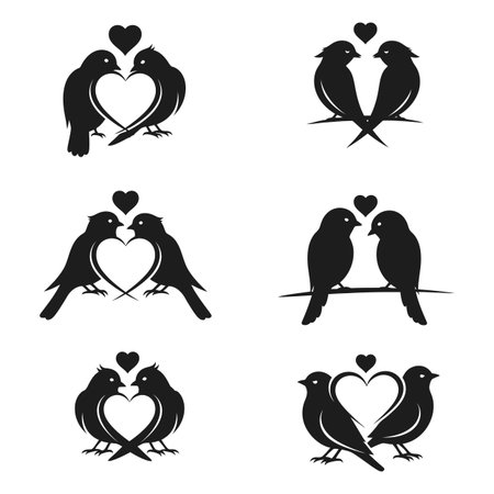 Black silhouette illustrations of loving bird couples forming heart shapesのイラスト素材