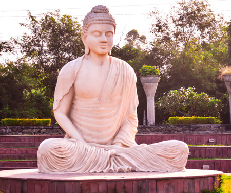 STATUE OF LORD BUDDHA IN PUBLIC PARKの写真素材