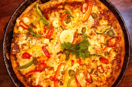 HOMEMADE VEGETARIAN PIZZA SERVED ON A PANの写真素材