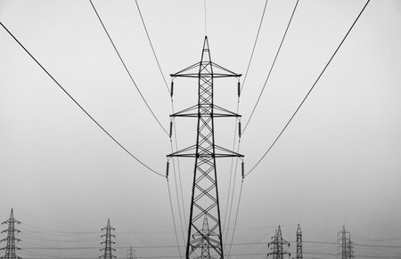 Silhouette of electricity post in the evening with clear sky.High-voltage electric power line