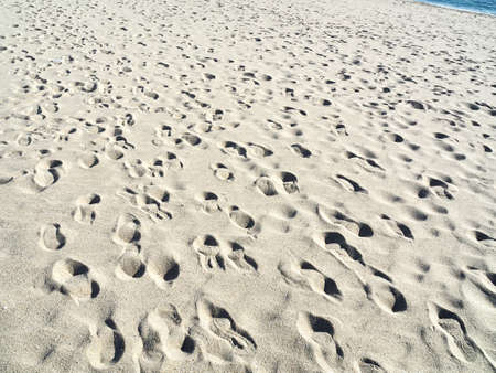 Sandy beach with footprints