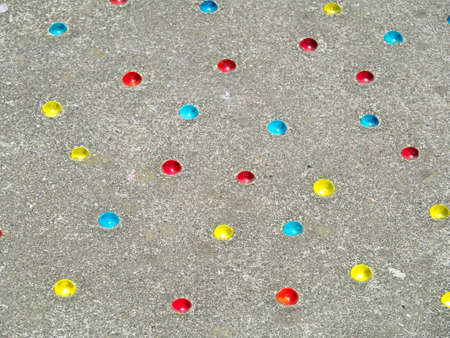 Marbles buried in the groundの写真素材