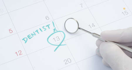 A note of a dentist appointment on a calendar, dental check upの写真素材