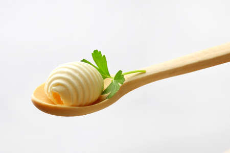 butter on the wooden spoonの写真素材