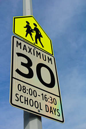 School Zone Sign with a Maximum Speed and Effective Hoursの写真素材