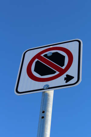 No Stopping Right of Sign Against Blue Skyの写真素材