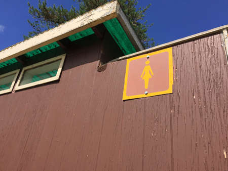 Female Sign Outside an Outdoor Tolietの写真素材