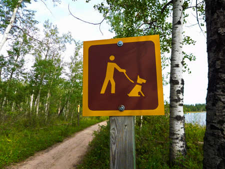 Dogs Must Be Kept on Leash On a Hiking Trailの写真素材