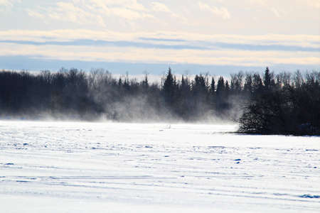 Blowing and Drifting Snow Across a Frozen Lakeの写真素材