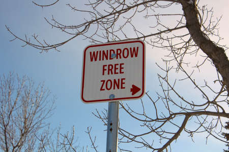 Windrow Free Zone Sign Against Blue Sky.の写真素材