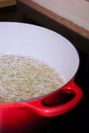 Macro of a pot of boiling sugar candy.の写真素材