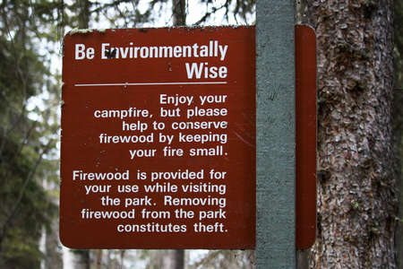 Be Environmentally Wise sign asking to conserve wood.のeditorial素材