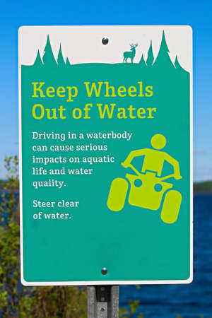 Keep wheels out of water sign along a lakeshore.の写真素材