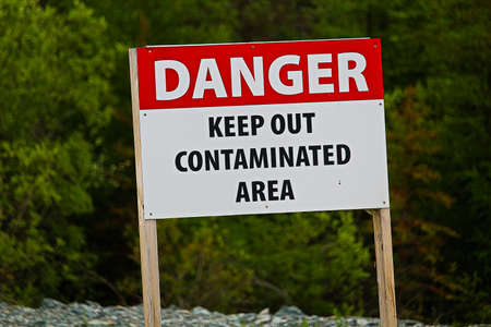 Closeup of a danger keep out of contaminated area sign.の写真素材