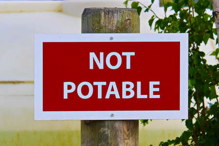 Closeup of a not potable sign.の写真素材