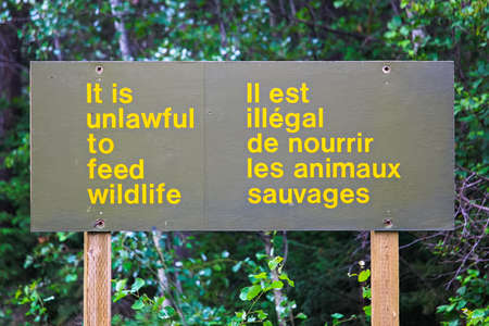 And it is unlawful to feed wildlife sign.の写真素材