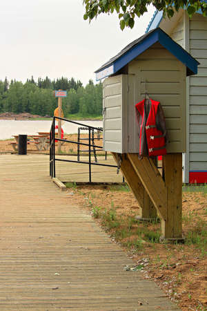 A life jacket loaner station at a public beach.の写真素材