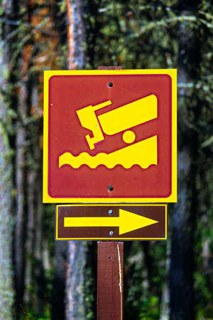 A boat launch direction sign with an arrow.の写真素材