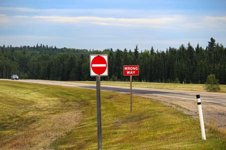A Do Not Enter and Wrong Way sign on a highway