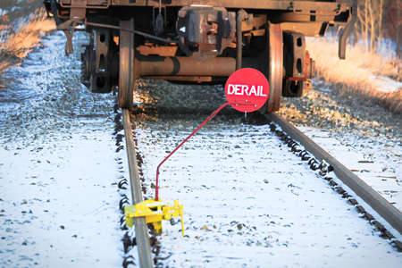 Closeup of a derail sign on a track rail