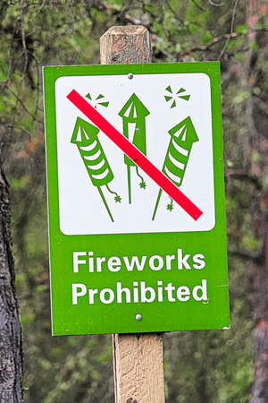 Closeup of a green fireworks prohibited signの写真素材