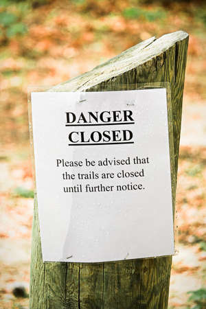 Closeup of a danger hiking trails closed signの写真素材