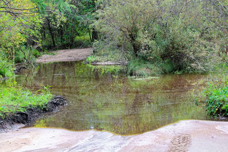 A flooded out portion of an atv trail