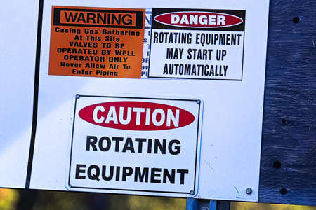 An industry caution rotating equipment warning signの写真素材