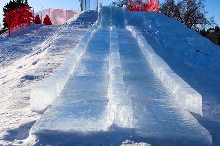 View looking up an ice slide hillの写真素材