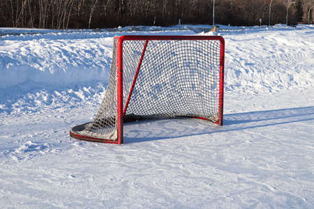 Views of a hockey net on an outdoor rink