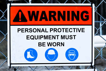 A Warning Personal Proctective Equipement Must Be Worn signの写真素材