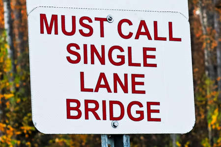 A Must Call, Single Lane Bridge sign