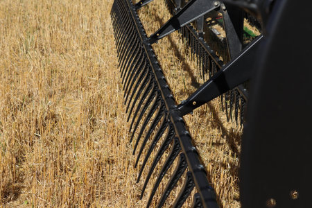 BONNYVILLE, ALBERTA, CANADA - SEPTEMBER 12, 2020: Closeup view of John Deere tines on a combine parked during harvestのeditorial素材