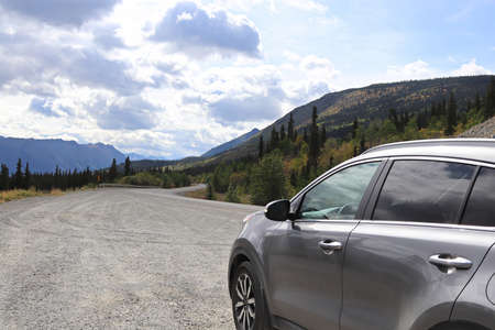 View of a vehicle parked at a roadside turnout