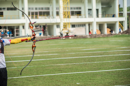 archer bending a bow and aimingのeditorial素材