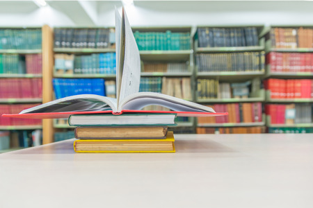 A pile of books with library on the backの写真素材